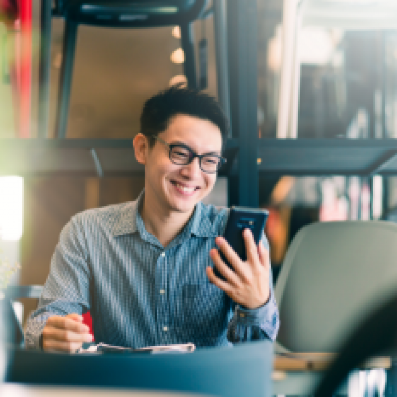 Smiling man with phone in his hand - Cloned