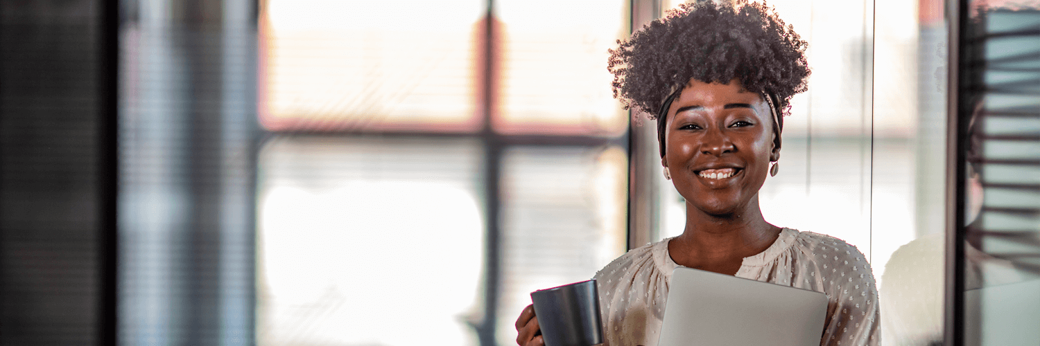 Woman smiling with coffee